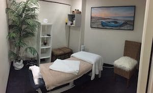 Massage therapists Brisbane treating upper back tension in a PhysioWorks massage room