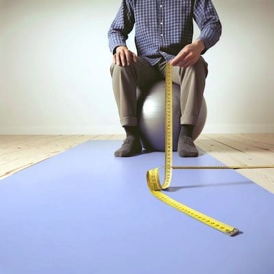 ball chair height should be at least the height of your your thigh when seated.