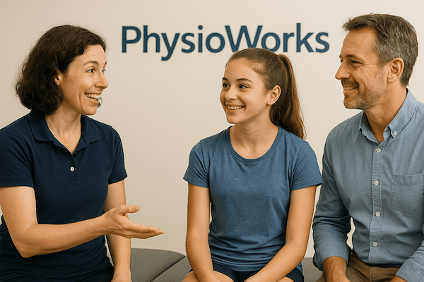 Avulsion fracture consultation at PhysioWorks Discussion about avulsion fracture between physiotherapist in navy polo, adolescent athlete and parent at PhysioWorks clinic.