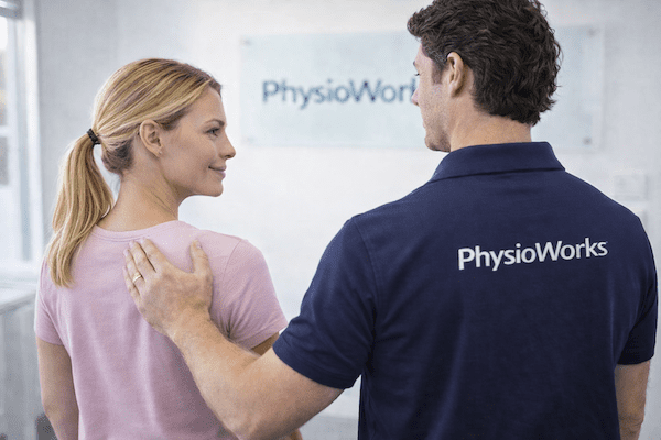 physiotherapist-assessing-upper-back-pain-thoracic-spine-1 Physiotherapist assessing upper back pain and thoracic spine movement in clinic