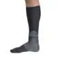 Side view of a lower leg wearing the Push Sports Ankle Brace Kicx by Push Sports, featuring a dark compression sleeve, gray ankle support wrap, and a circular support element positioned on the lower calf, shown against a plain background.