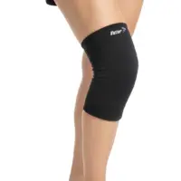 Person wearing the Victor Elastic Cold Sleeve in black, fitted securely around the knee for targeted cold therapy and compression support.