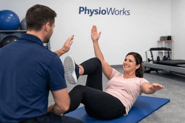 Core Stability Training Physiotherapy Session Core stability training dead bug exercise guided by physiotherapist
