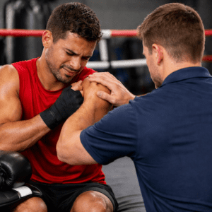 Boxing injuries physiotherapy assessment of boxer shoulder pain by physiotherapist in boxing gym