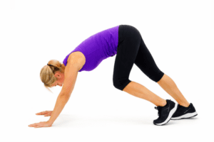 Blonde woman performing muscle cramps treatment calf stretch