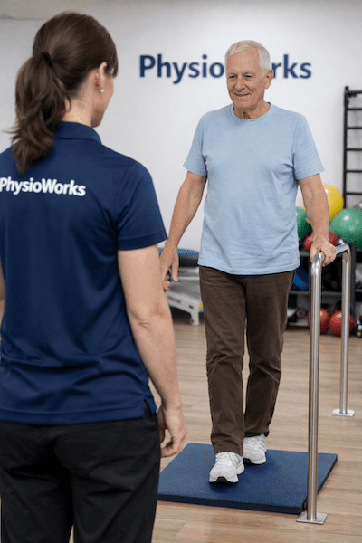 fall-prevention-heel-to-toe-balance-training Fall prevention heel-to-toe balance exercise with physiotherapist