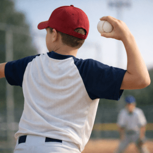 Junior athlete overhead throw showing shoulder load in throwing injuries