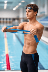 swimmer shoulder warm-up with resistance band before pool training