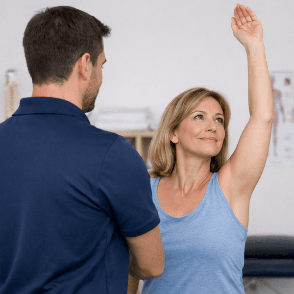 Personalised physiotherapy treatment shoulder movement assessment by physiotherapist during clinic evaluation