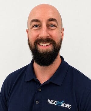 Tyler Cultum physiotherapist at PhysioWorks Ashgrove standing in modern clinic setting