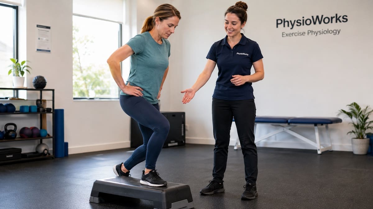 Pre-exercise assessment showing step-down control with exercise physiologist coaching.