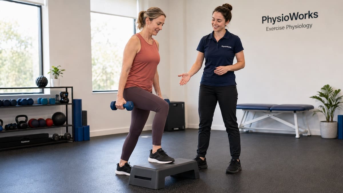 Pre-exercise assessment guiding step-up progression with exercise physiologist coaching.